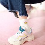 Chaussettes ludiques avec créatures préhistoriques