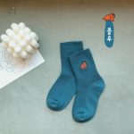 Chaussettes ludiques avec design dinosaure fluo