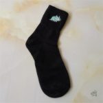 Chaussettes avec motif de dinosaures colorés