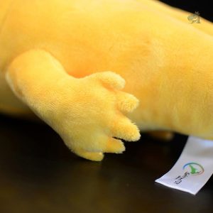 Coussin peluche dinosaure jaune, doux et décoratif