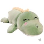 Peluche dinosaure verte aux yeux fermés