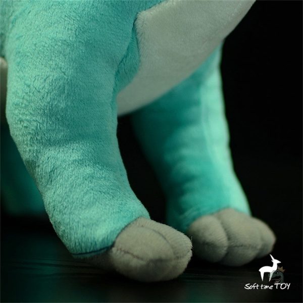 Doudou en forme de dinosaure vert pour les petits