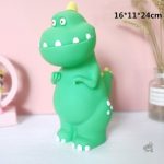 Tirelire dinosaure joyeuse pour les premiers pas d'épargne