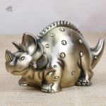 Accessoire ludique : tirelire dinosaure